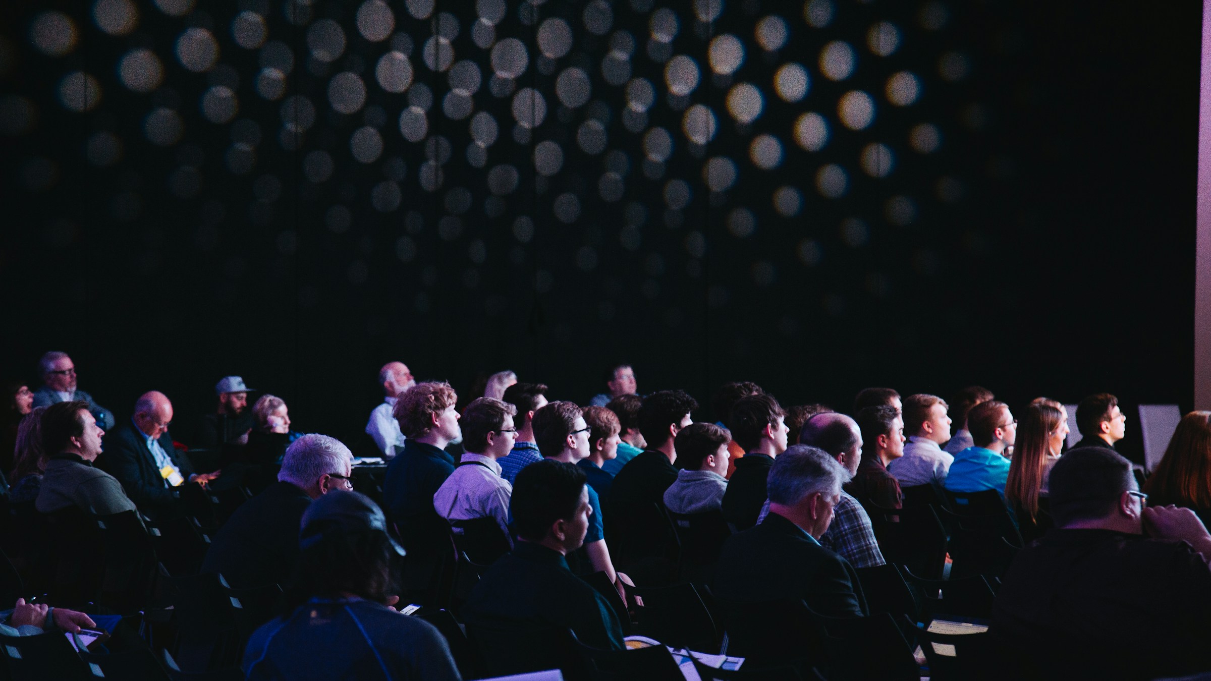 Corporate event audience watching a presentation